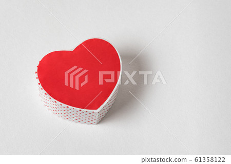 Red heart shaped box on the white background. Copy 61358122