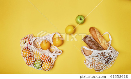 Replacing plastic bags. Taking care of the environment.Nets with products. Simple and useful. The fruit and bread. 61358618
