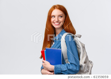 Girl seeing classmate in hall saying hi, turning back to greet someone, smiling joyfully, holding backpack and notebooks, heading back to class, studying in college, standing white background Girl seeing classmate in hall saying hi, turning back to greet someone, smiling joyfully, holding backpack and notebooks, heading back to class, studying in college, standing white background 61359059