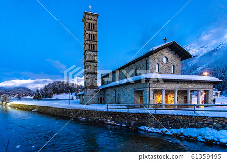 Church by the St. Moritz lake covered in snow Church by the St. Moritz lake covered in snow 61359495