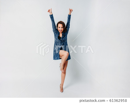 Happy beautiful brunette young woman dressed Happy beautiful brunette young woman dressed 61362958