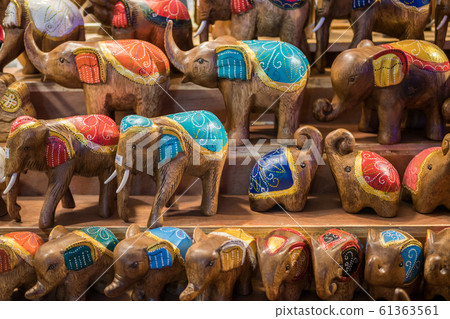 Close-up view of the carved wooden elephants 61363561