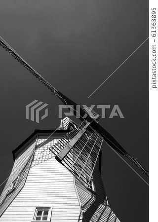 Looking upwards to the windmill building in black and white. Looking upwards to the windmill building in black and white. 61363895
