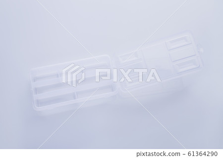 Opened separated transparent container. 61364290