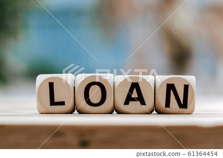 LOAN concept with wooden block on wooden table LOAN concept with wooden block on wooden table 61364454