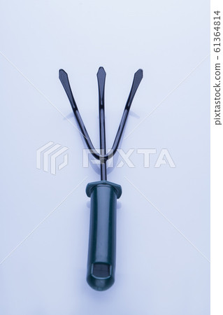 The garden tool rake with three jaws. 61364814
