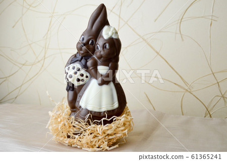 Two chocolate rabbits. Two tasty, embracing Two chocolate rabbits. Two tasty, embracing 61365241