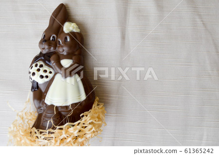 Two chocolate rabbits. Two tasty, embracing 61365242