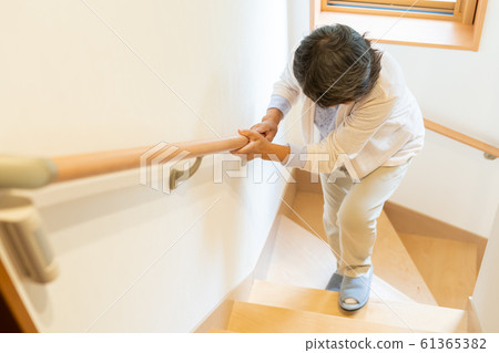 Senior female elderly old man going up stairs Senior female elderly old man going up stairs 61365382