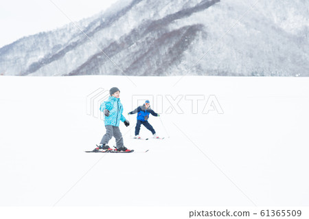 Family enjoying winter Family enjoying winter 61365509