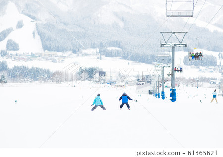 Kids enjoying skiing Kids enjoying skiing 61365621