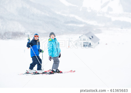Family enjoying ski Family enjoying ski 61365683