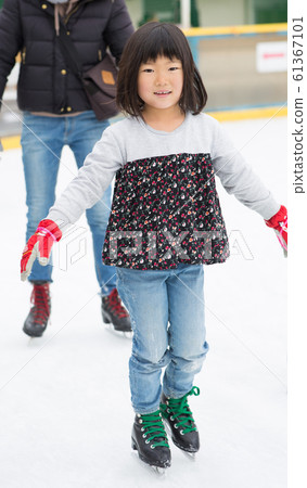 Children enjoying ice skating Children enjoying ice skating 61367101