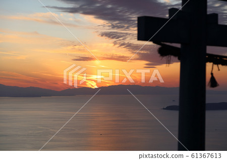 "Torii in the sky" at Takayacho, Kannonji, Takaya Shrine main shrine. The sun sets near Saijo City and Matsuyama City across Hiuchi Nada "Torii in the sky" at Takayacho, Kannonji, Takaya Shrine main shrine. The sun sets near Saijo City and Matsuyama City across Hiuchi Nada 61367613