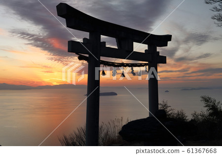 "Torii in the sky" at Takayacho, Kannonji, Takaya Shrine main shrine. The sun sets near Saijo City and Matsuyama City across Hiuchi Nada "Torii in the sky" at Takayacho, Kannonji, Takaya Shrine main shrine. The sun sets near Saijo City and Matsuyama City across Hiuchi Nada 61367668