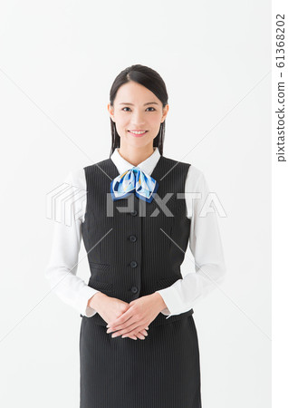 Working woman in uniform (white background vertical position) Working woman in uniform (white background vertical position) 61368202
