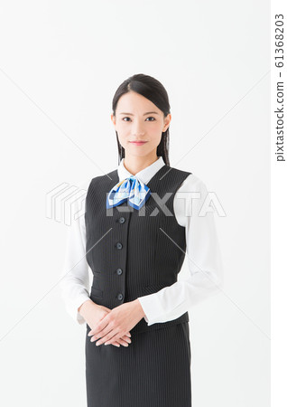 Working woman in uniform (white background vertical position) Working woman in uniform (white background vertical position) 61368203