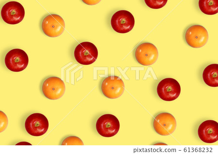 orange and apple pattern on yellow pastel 61368232