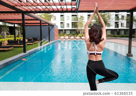 young healthy and sporty woman do yoga stretching outdoor (this image for workout and training concept) 61368535