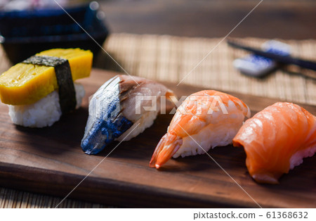 Mix sushi on wood dish, tuna, salmon, sea bass, Mix sushi on wood dish, tuna, salmon, sea bass, 61368632