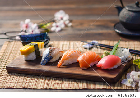 Mix sushi on wood dish, tuna, salmon, sea bass, 61368633