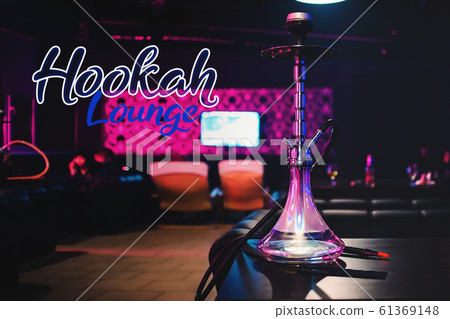 Beautiful glass hookah on the table in the restaurant 61369148