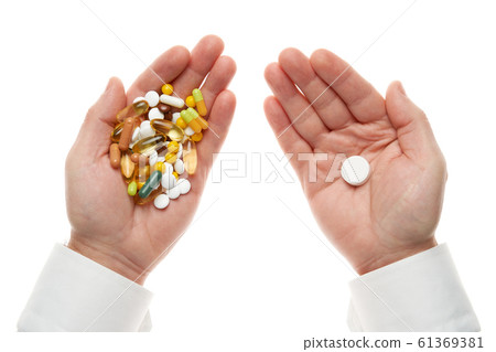 Man hand getting one pill from handful of pills, Man hand getting one pill from handful of pills, 61369381