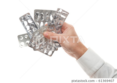 Man hand with used pills blister isolated on white Man hand with used pills blister isolated on white 61369407