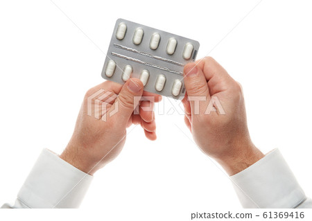 Man hand with pills blister isolated on white Man hand with pills blister isolated on white 61369416