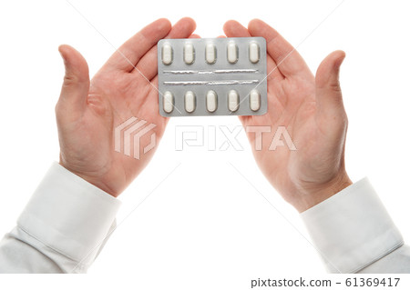 Man hand with pills blister isolated on white Man hand with pills blister isolated on white 61369417