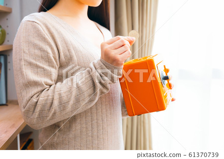 A woman saving money 61370739