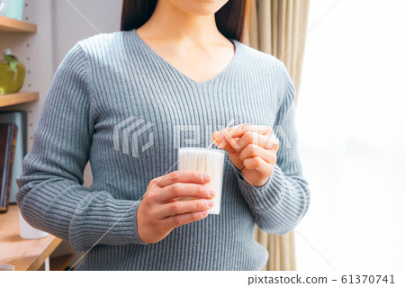 Woman taking out baby swab Woman taking out baby swab 61370741