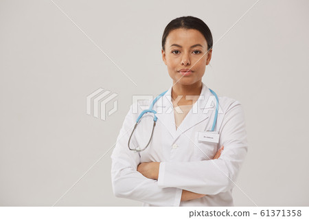 Young Female Doctor Posing on White 61371358