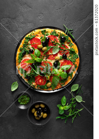 Pizza. Traditional italian pizza with green basil Pizza. Traditional italian pizza with green basil 61372020