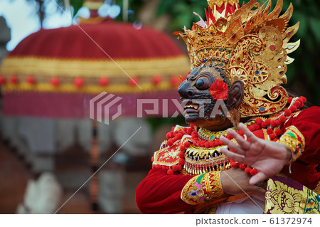 Dancer man in traditional Balinese costume and 61372974
