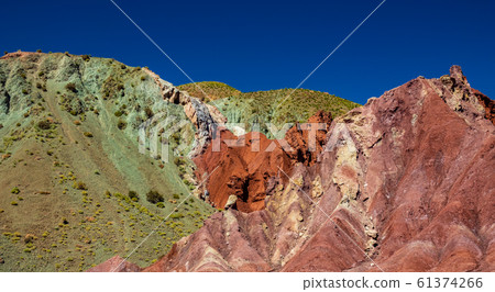 Red and green sand colors under blue sky Red and green sand colors under blue sky 61374266