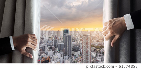 Business people hand opening curtain with Osaka city view in the morning sunrise 61374855