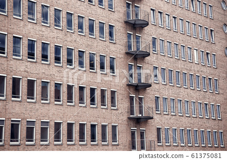 Building facade wall background of red bricks in Building facade wall background of red bricks in 61375081