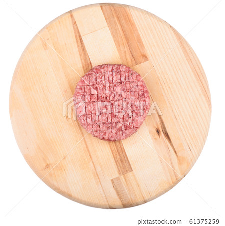 Raw pink beef cutlet isolated on a cutting board. Raw pink beef cutlet isolated on a cutting board. 61375259