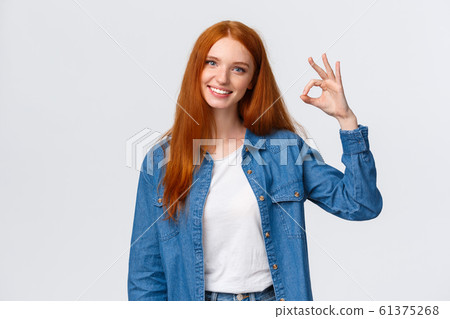 Teamwork, communication and people concept. Supportive good-looking female team member, girl coworker showing okay gesture and smiling with approval, agree or like something, white background Teamwork, communication and people concept. Supportive good-looking female team member, girl coworker showing okay gesture and smiling with approval, agree or like something, white background 61375268