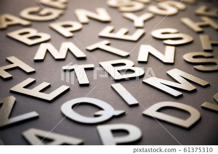 Mixed letters pile closeup photo 61375310
