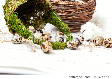 Easter decoration with eggs and basket on white 61375434