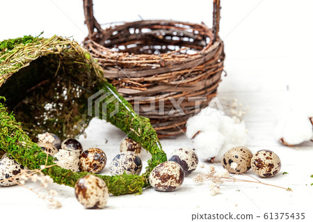 Easter decoration with eggs and basket on white 61375435