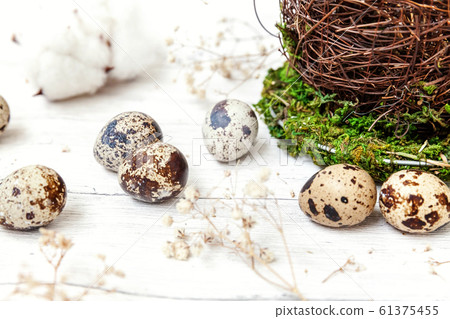 Easter decoration with eggs and basket on white Easter decoration with eggs and basket on white 61375455