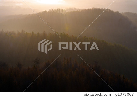Orange colors of sunrise in mountains, morning 61375868