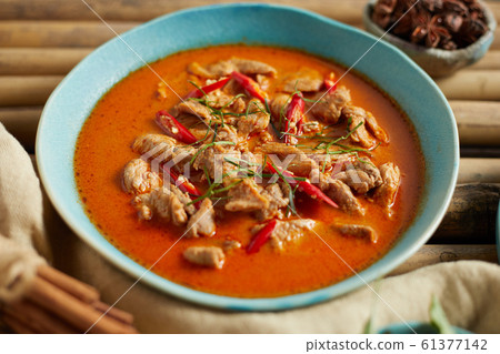 Dried red pork coconut curry, Thai cuisine. 61377142