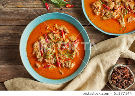 Dried red pork coconut curry, Thai cuisine. 61377144