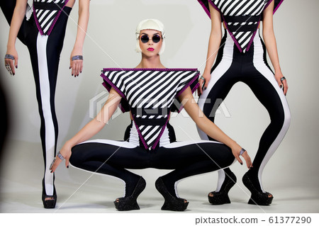 Dancing fashion girls on white background 5k 61377290