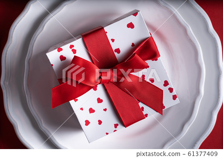 Vatentine's day concept - present on red background 61377409