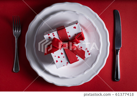 Vatentine's day concept - present on red background 61377418
